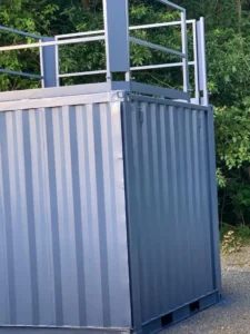 A metal container with a railing on top of it.